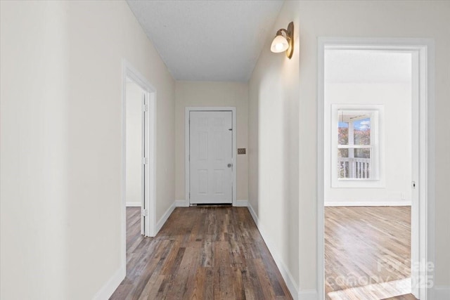 corridor featuring hardwood / wood-style flooring