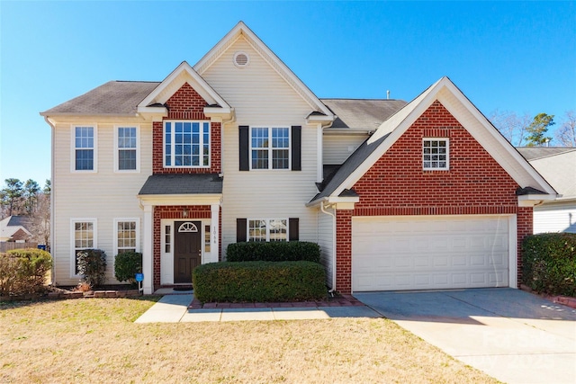 view of front of property with brick siding, driveway, and a front lawn