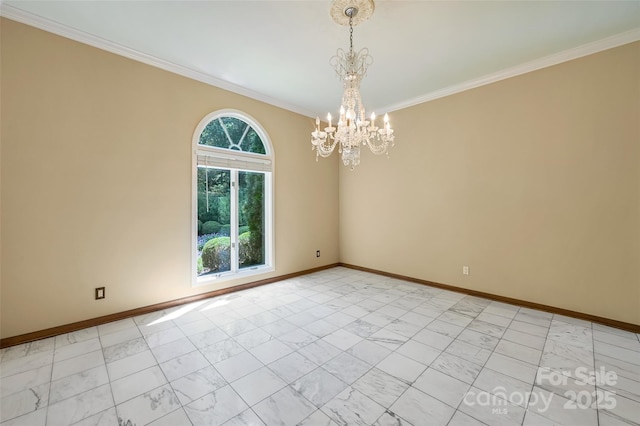 spare room with ornamental molding and an inviting chandelier