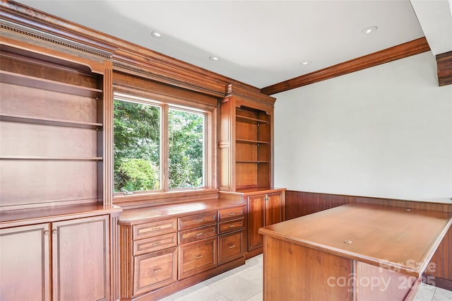 unfurnished office featuring crown molding and light tile patterned floors