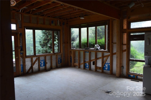 unfurnished sunroom with plenty of natural light