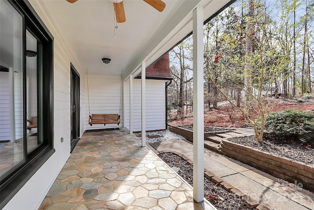 view of patio / terrace featuring ceiling fan