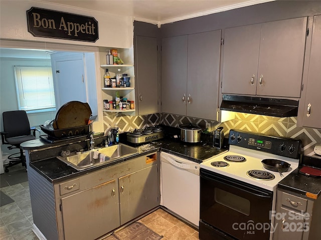 kitchen with white dishwasher, under cabinet range hood, a sink, electric stove, and dark countertops