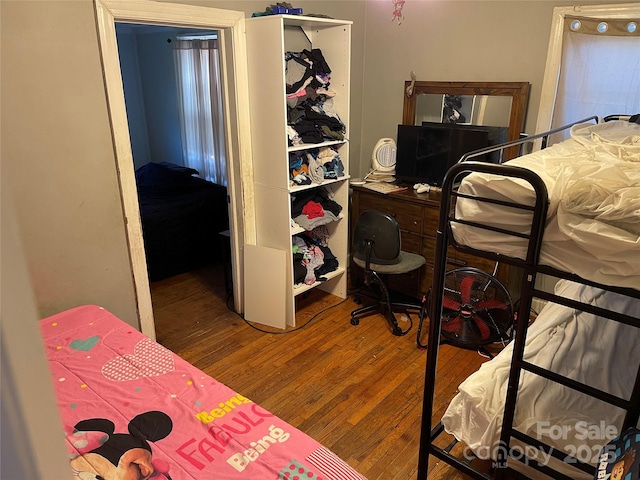 bedroom featuring wood finished floors