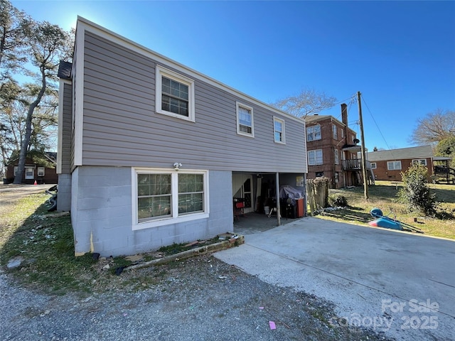 rear view of house with driveway