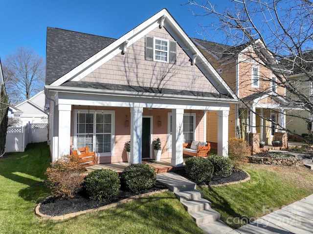 view of front of home with a front lawn and a porch