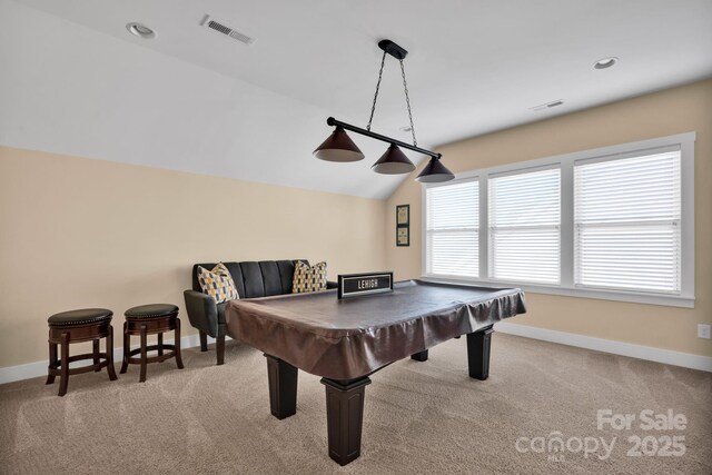 game room featuring light colored carpet, visible vents, lofted ceiling, and baseboards