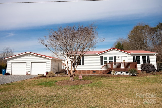 manufactured / mobile home with crawl space, a garage, metal roof, and a front yard