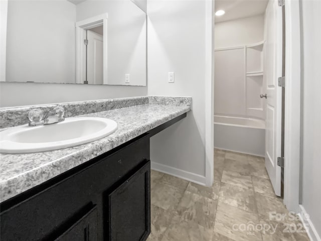 bathroom featuring vanity and bathtub / shower combination