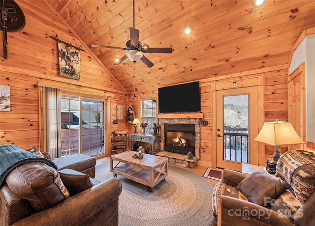 living area with wooden walls and a fireplace