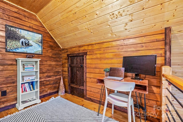 office area featuring vaulted ceiling, wood walls, wood finished floors, and wood ceiling