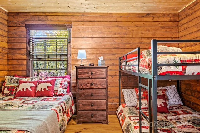 bedroom with wood ceiling and wood finished floors