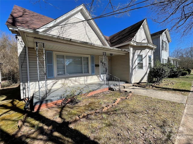 view of front of home featuring roof with shingles