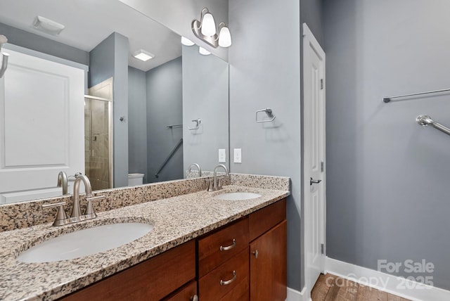 bathroom with vanity and walk in shower