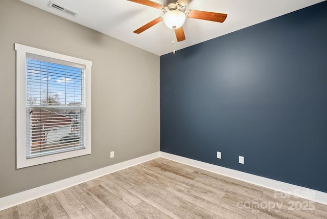 unfurnished room featuring light wood-type flooring and ceiling fan