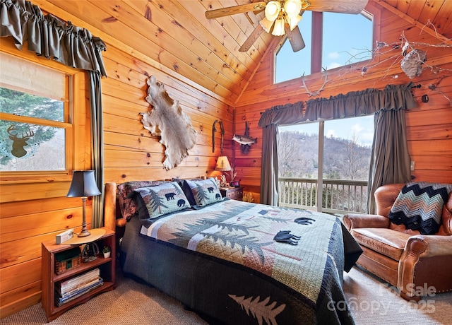 bedroom featuring wood walls, wood ceiling, lofted ceiling, and multiple windows