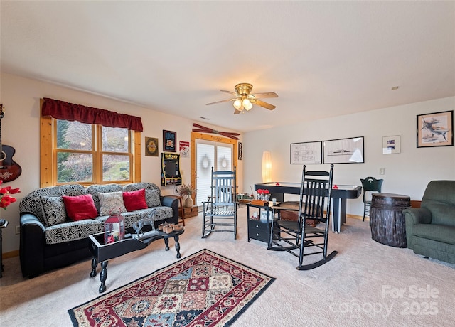 carpeted living room with ceiling fan