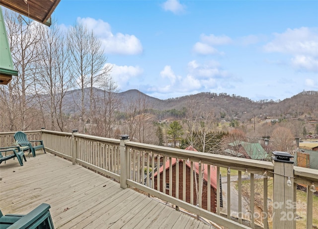 wooden deck featuring a mountain view