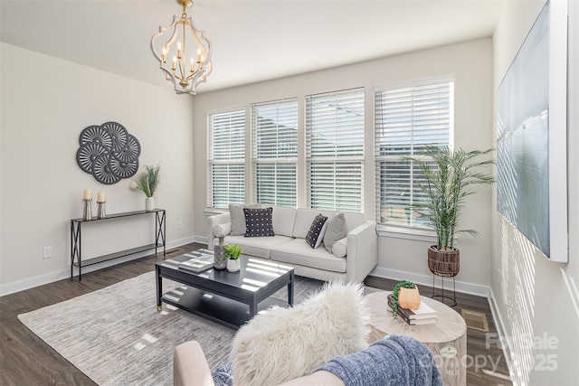 living room with dark wood-style flooring, a healthy amount of sunlight, and baseboards