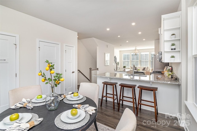 dining space with recessed lighting and dark wood-style flooring