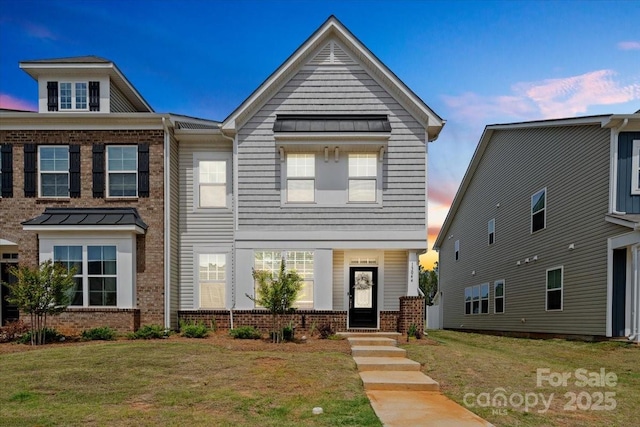 view of front of property with a yard