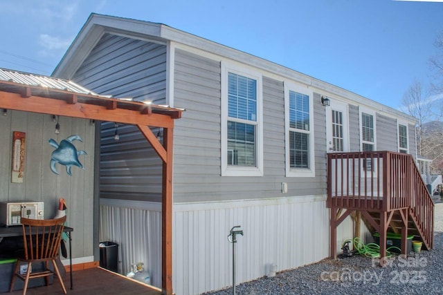 view of home's exterior with metal roof