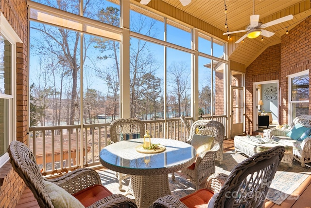 sunroom with wooden ceiling, vaulted ceiling, and a ceiling fan