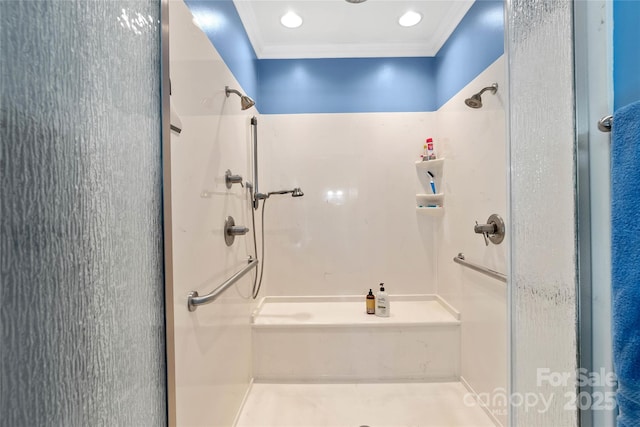 bathroom with crown molding and walk in shower