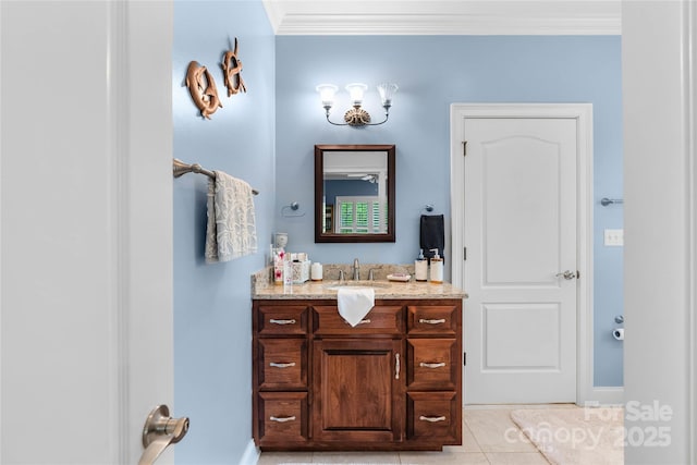 bathroom featuring ornamental molding, vanity, and tile patterned floors