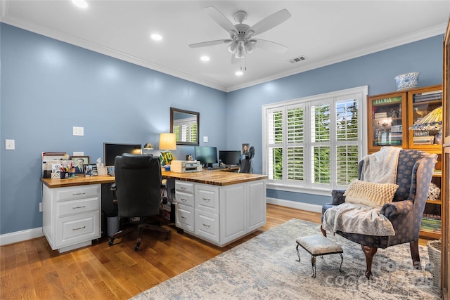 office area featuring ornamental molding, visible vents, and light wood-style floors