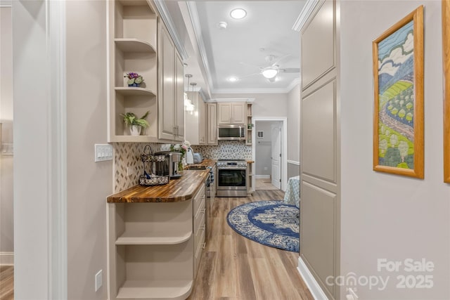 interior space with ornamental molding and light wood-style flooring