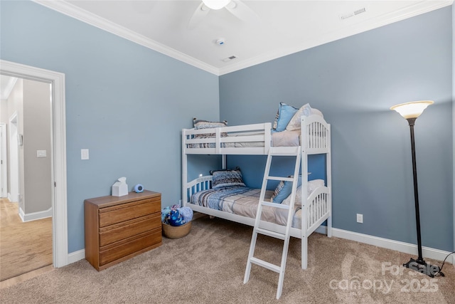 bedroom featuring ornamental molding, carpet flooring, visible vents, and baseboards