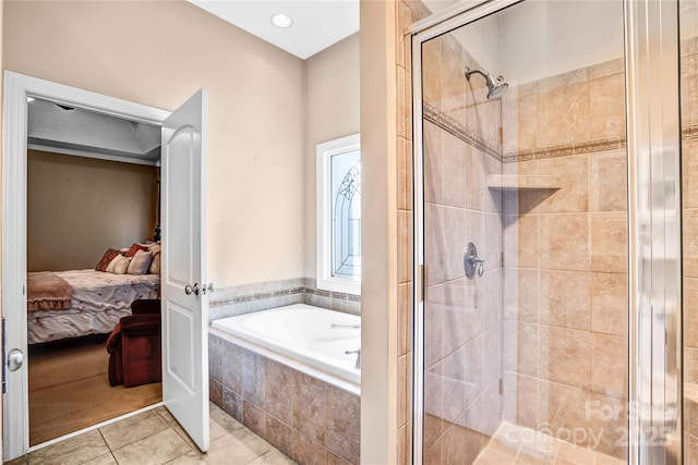 full bath with ensuite bathroom, a stall shower, a bath, and tile patterned floors