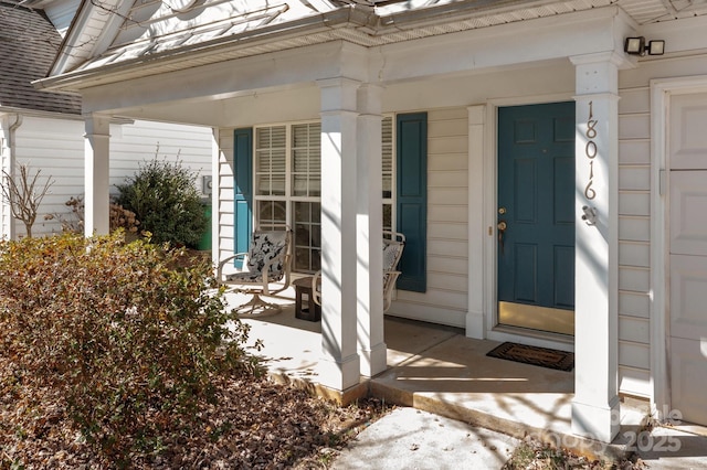 doorway to property with covered porch