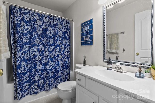 full bathroom with vanity, toilet, and shower / bath combo with shower curtain