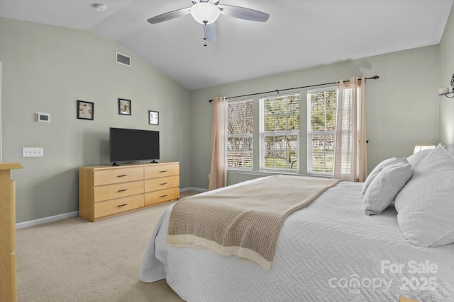 bedroom featuring visible vents, baseboards, a ceiling fan, lofted ceiling, and carpet