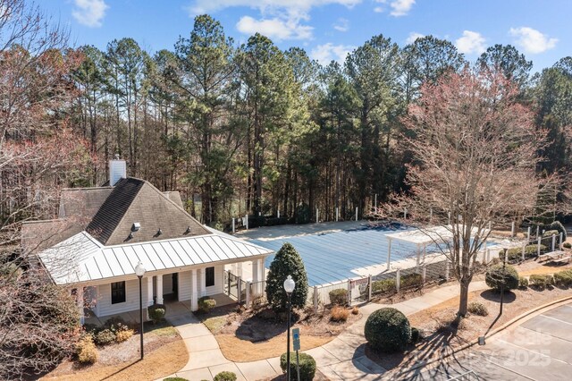 view of pool with covered porch