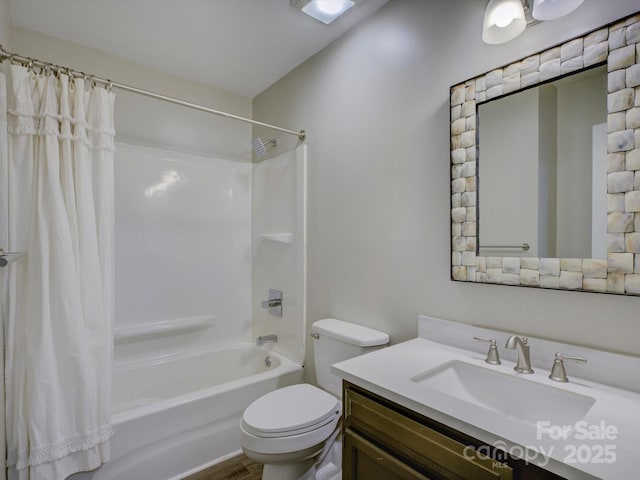 bathroom with vanity, toilet, and shower / bath combo with shower curtain