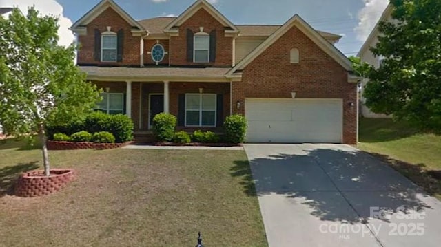 view of front of house featuring a front yard and a garage