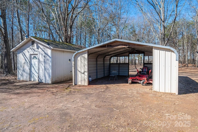 view of outbuilding featuring an outbuilding and a carport