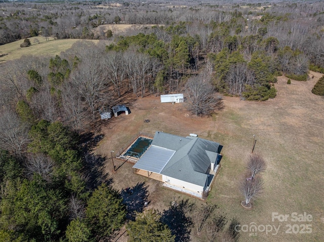 birds eye view of property with a rural view