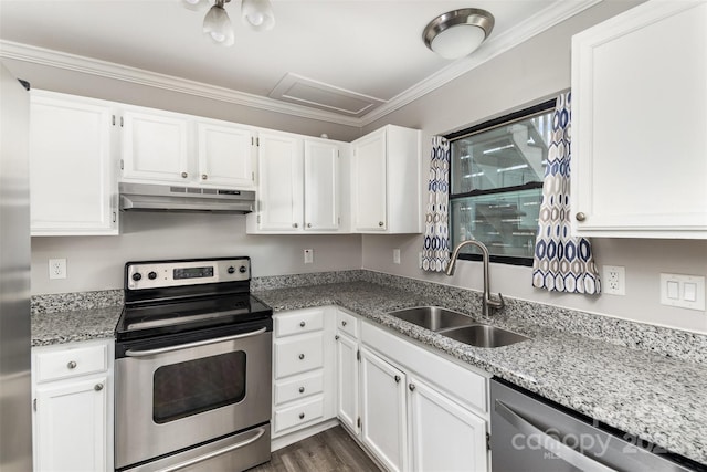 kitchen with under cabinet range hood, white cabinetry, appliances with stainless steel finishes, and a sink