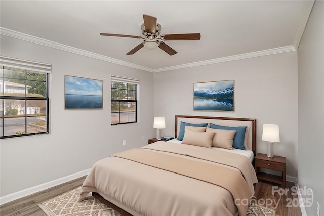 bedroom featuring multiple windows, ornamental molding, and wood finished floors