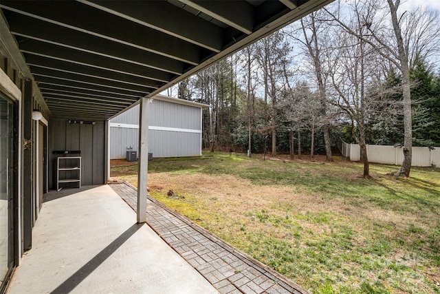 view of yard with central AC, a patio area, and fence