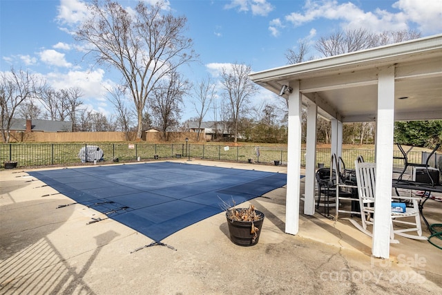 view of pool featuring a patio, a fenced backyard, and a fenced in pool