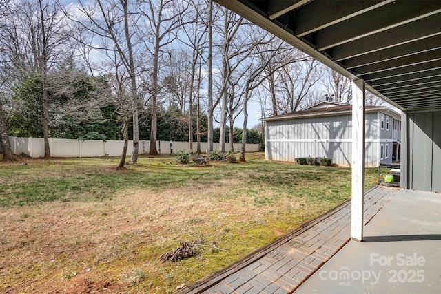 view of yard featuring a patio area and a fenced backyard