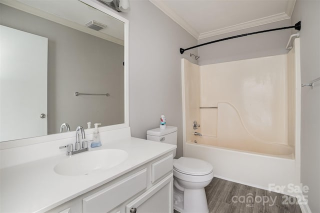 full bath featuring visible vents, bathing tub / shower combination, toilet, ornamental molding, and vanity