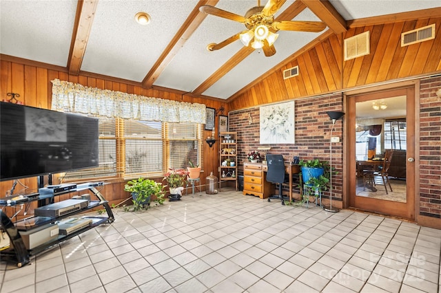 sunroom with lofted ceiling with beams and ceiling fan