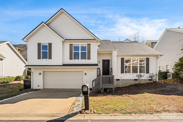 split level home with driveway, a garage, a shingled roof, crawl space, and cooling unit