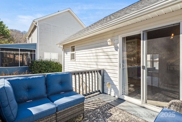 deck with a sunroom and an outdoor living space